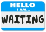 Hello I Am Waiting words on a nametag sticker to illustrate bein