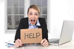 Young Stressed Businesswoman Holding Help Sign Overworked At Off